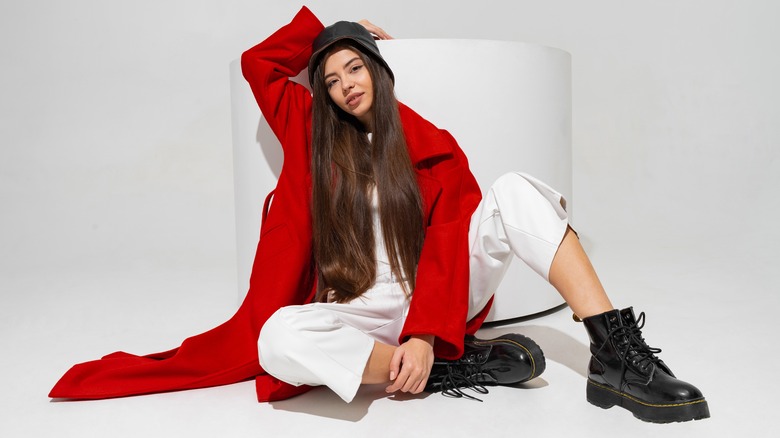 woman in red coat and black boots