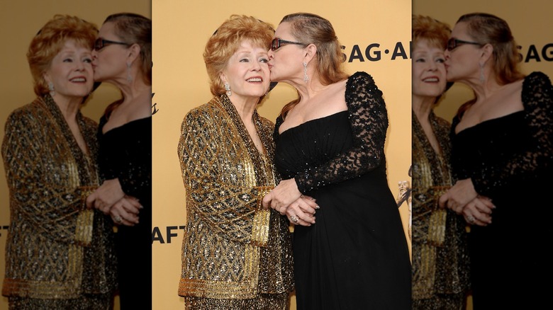 Debbie Reynolds and Carrie Fisher pose in the press room at the 21st annual Screen Actors Guild Awards at The Shrine Auditorium on January 25, 2015 in Los Angele