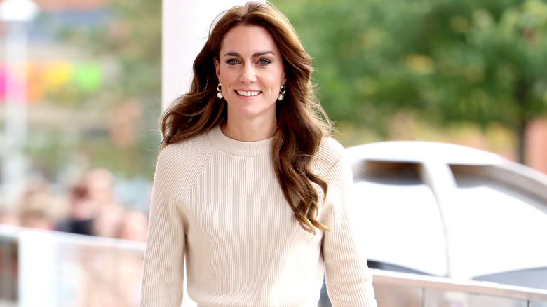 Kate Middleton wearing a white knit sweater