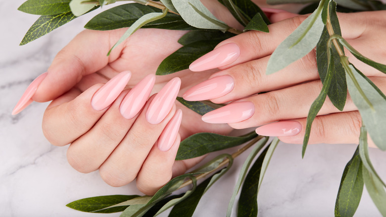 Manicured nails in leaves