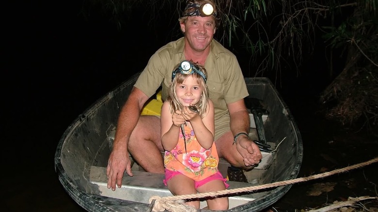 Steve Irwin and Bindi Irwin on a boat wearing headlamps