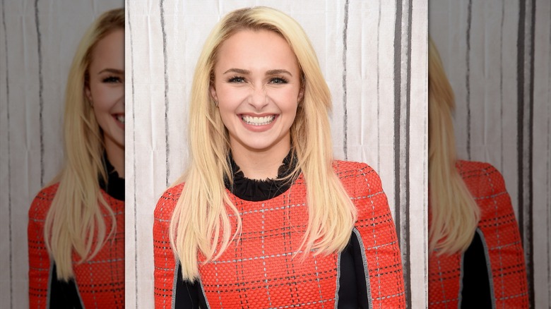 Hayden Panettiere with her hair parted on the side and layered around the face