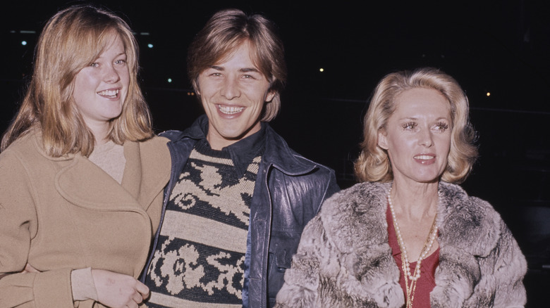 Melanie Griffith, Don Johnson, and Tippi Hedren smiling in 1974