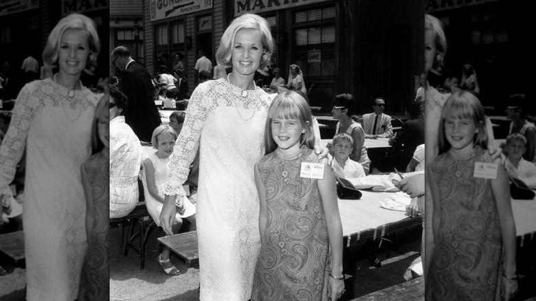 Tippi Hedren and her daughter, Melanie Griffith, at a children's party, a 'Batman' luncheon for an orphanage in California 1966