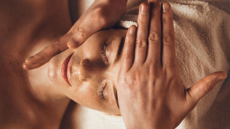 woman getting facial spa