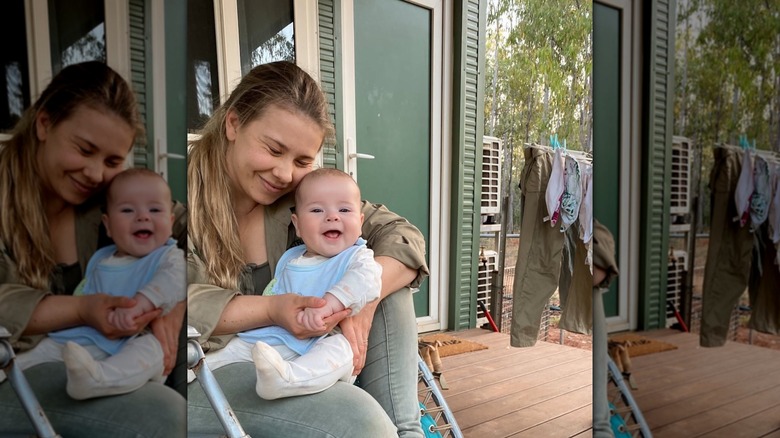 Bindi Irwin cuddling with her daughter Grace as a baby