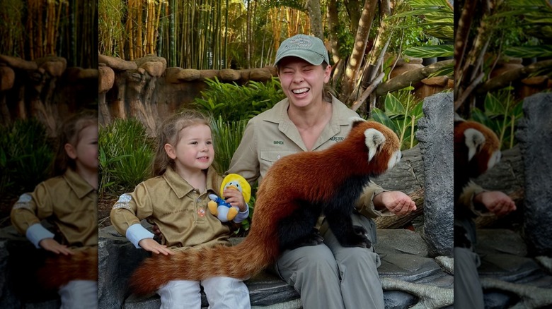 Bindi Irwin with her daughter Grace and a red panda