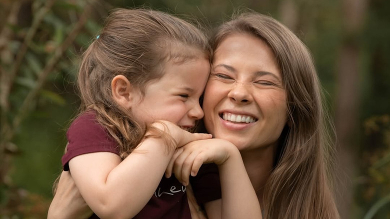 Bindi Irwin cuddling with her daughter Grace