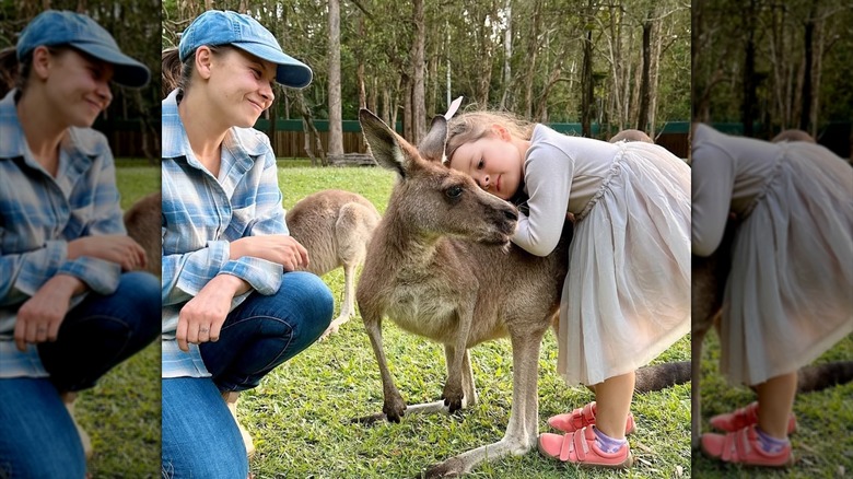 Bindi Irwin and Grace cuddling a kangaroo
