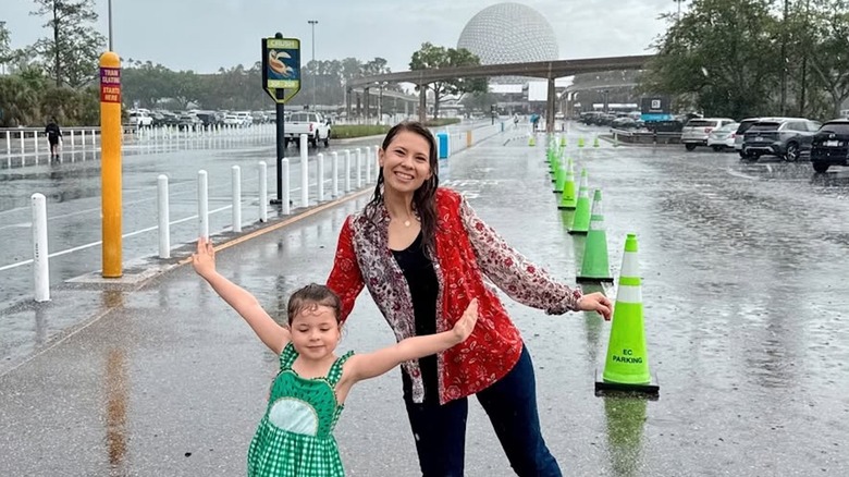Bindi Irwin with Grace in the rain outside Epcot