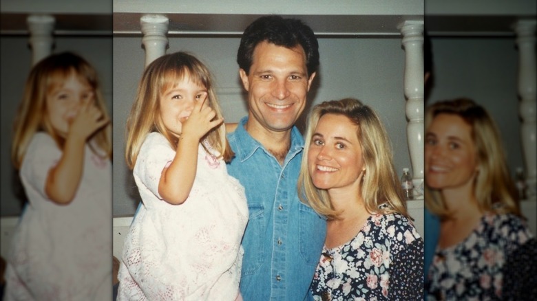 Maureen McCormick, Michael Cummings, and their daughter smile together