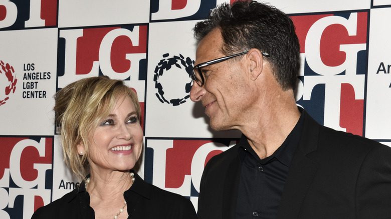 Maureen McCormick and Michael Cummings smile at each other