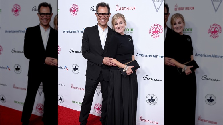 Michael Cummings and Maureen McCormick smile in matching black