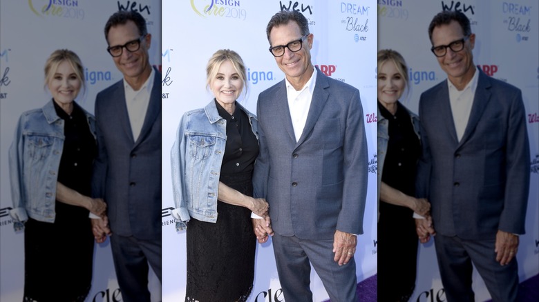 Maureen McCormick holds Michael Cummings' hand