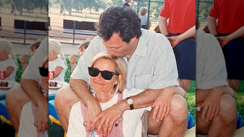 Michael Cummings kisses Maureen McCormick's head