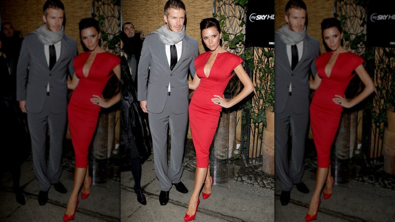 Victoria Beckham in a red dress with David Beckham
