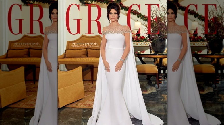 Kimberly Guilfoyle posing in a white dress on the cover of Grace
