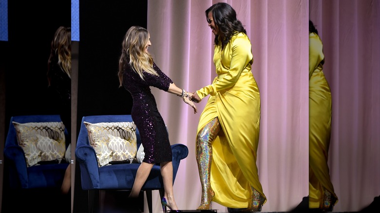 Michelle Obama in 2018 in a yellow dress with boots