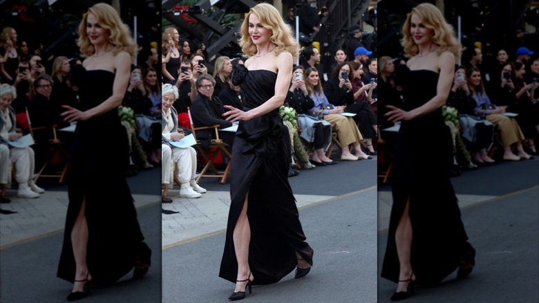 Nicole Kidman walking the runway in a black dress in October 2025