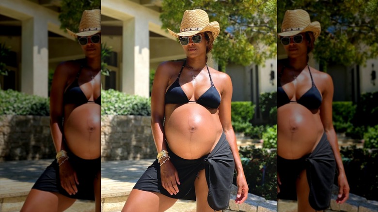 Ciara posing in a bikini that shows off her baby bump