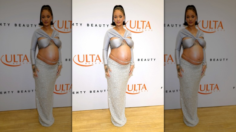 Rihanna posing in a silver outfit in March 2022