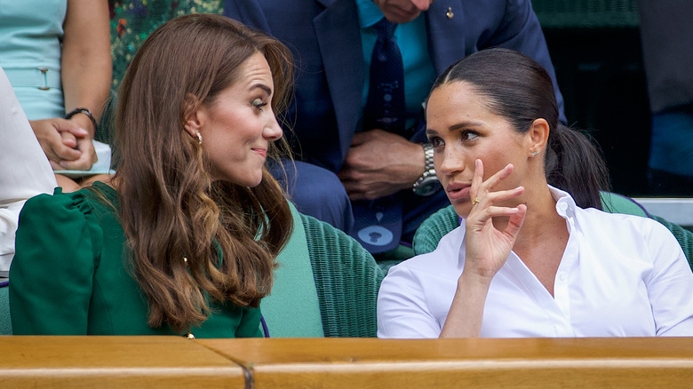 Kate Middleton and Meghan Markle talking