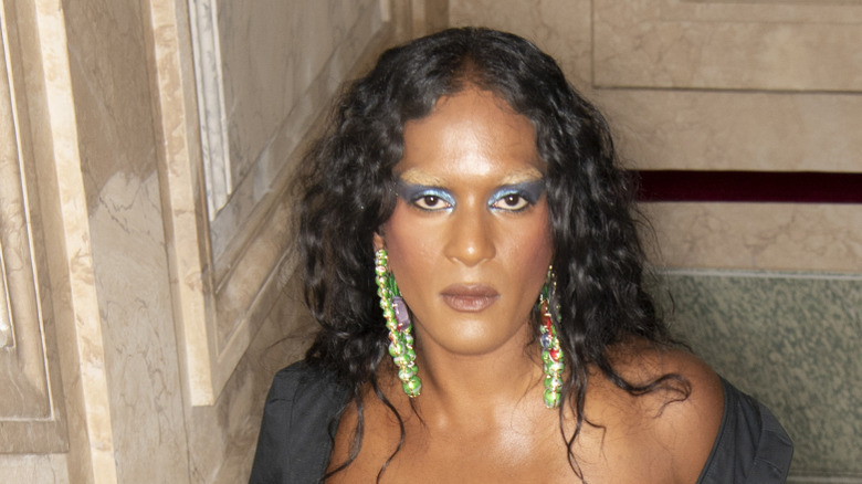 Law Roach with dramatic eye makeup and bleached eyebrows
