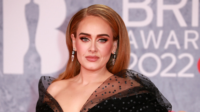 Adele posing in a bold eyeliner look