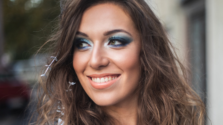 Woman with bright blue eyeshadow