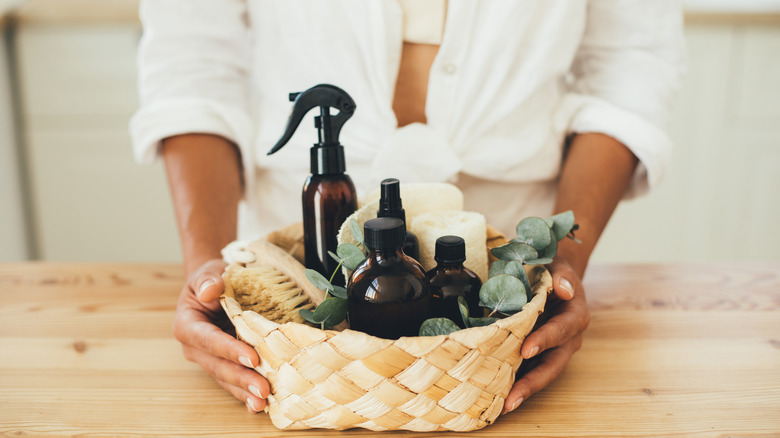 basket of cleaning supplies on table