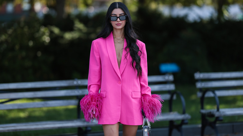 Woman wearing hot pink blazer