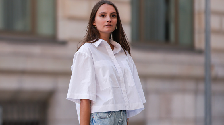 Woman wearing white short-sleeve button-down