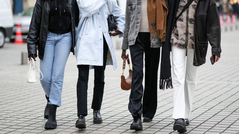 Women wearing different shades of denim