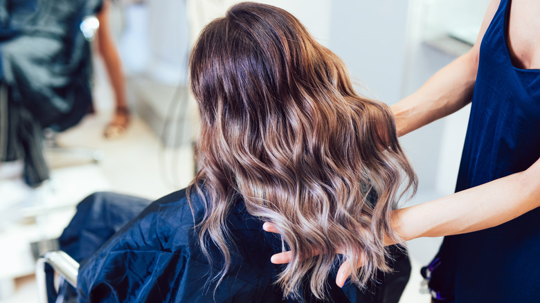 woman in salon with fresh haircut