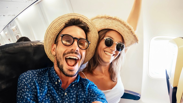 Happy couple on a flight