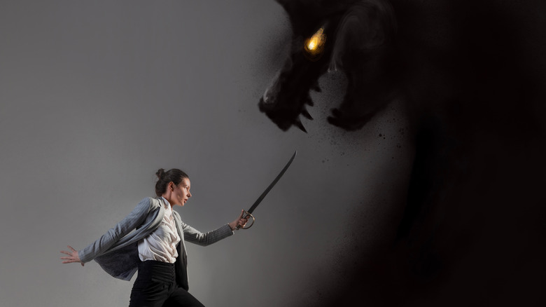 person battling their shadow