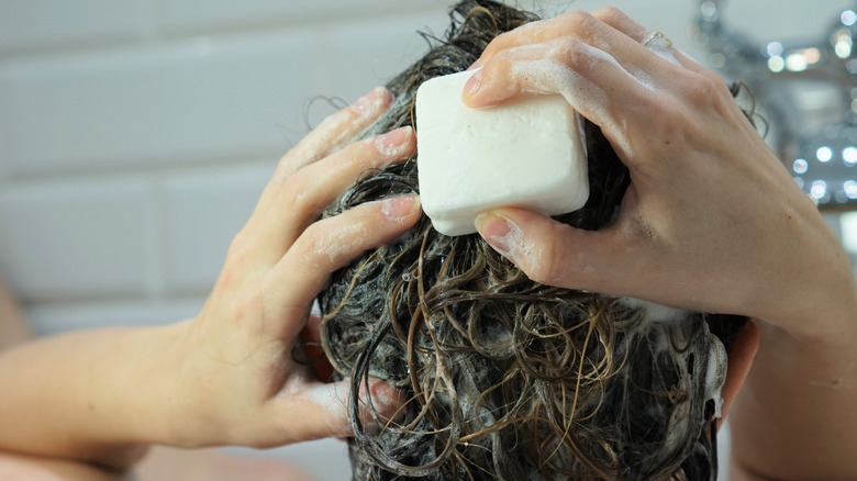 Person bar shampooing their hair 