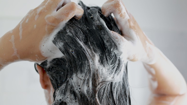 Person shampooing thier hair 