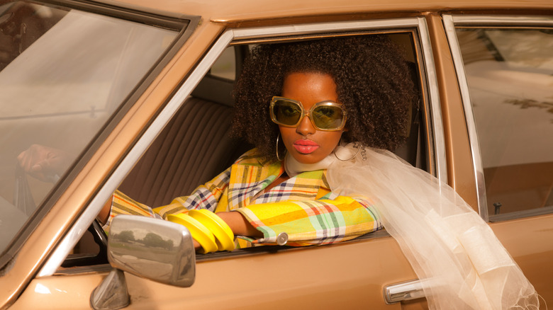 Woman with curly hair driving