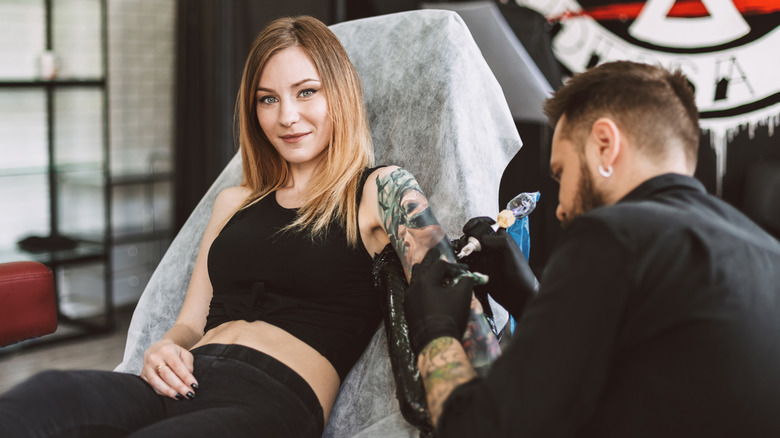 woman getting a tattoo