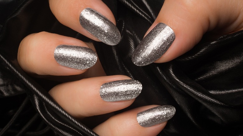 silver fingernails black background