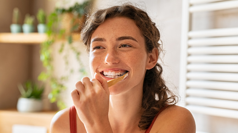 Woman brushing her teeth