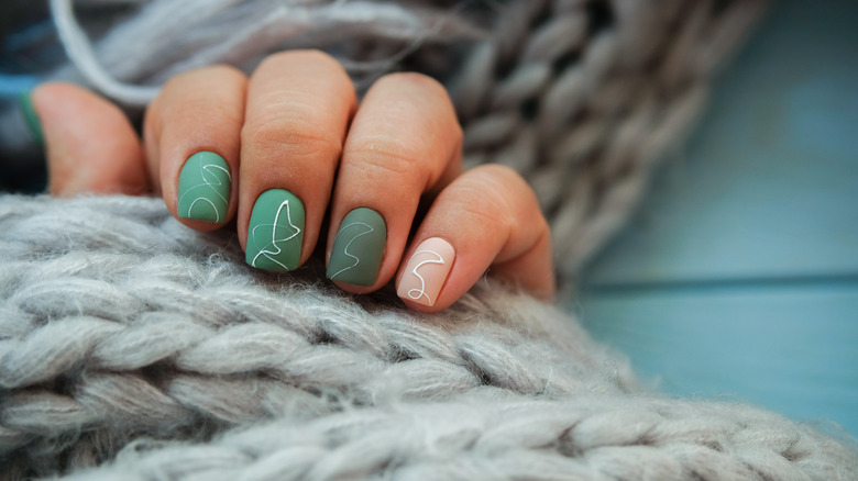 green nails with nail art