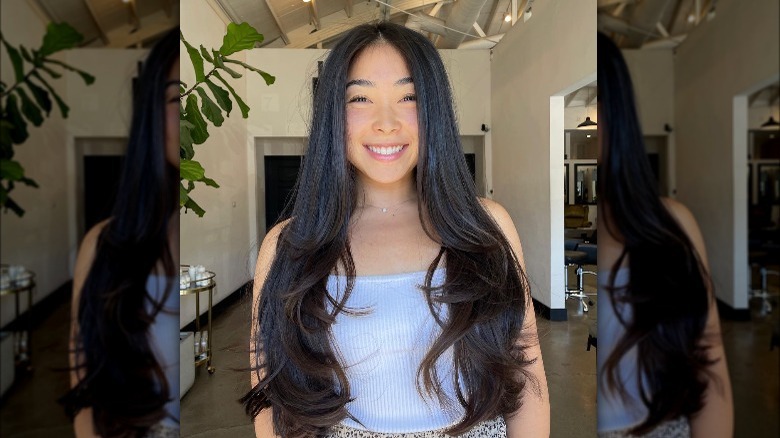 woman with long layered hair 