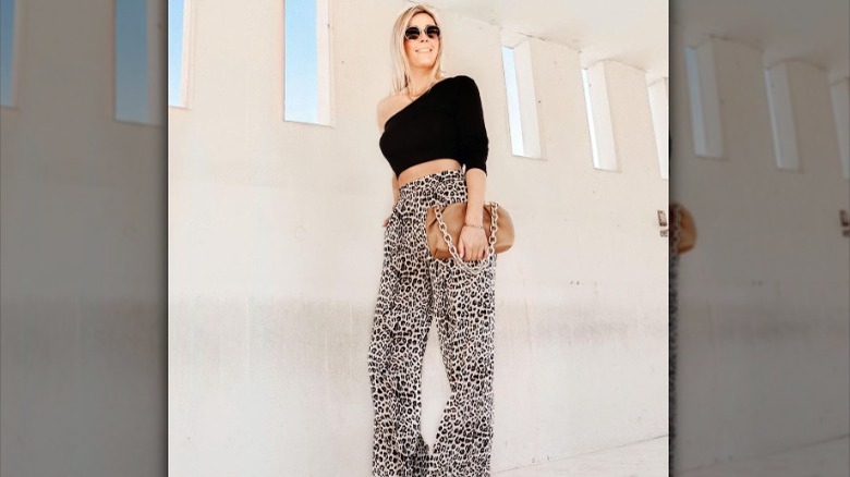 Modeling animal print pants, crop top