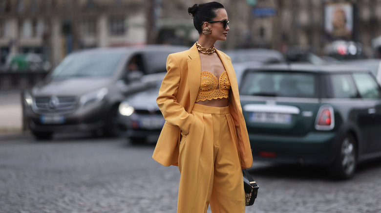 Woman wearing crop top, blazer