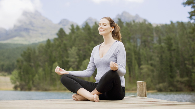 woman meditating outside