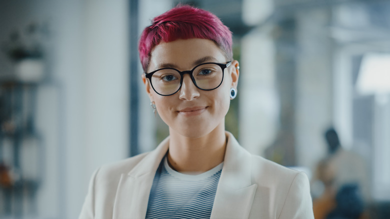 business woman with short pink hair