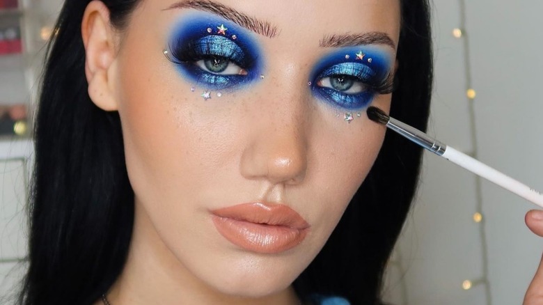 A woman with blue eyeshadow