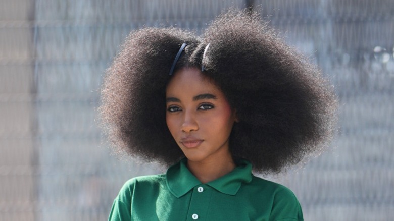 A woman with a soft afro hairstyle